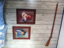 Only at my parents house, would you sleep beneath sweet photos and a gun.